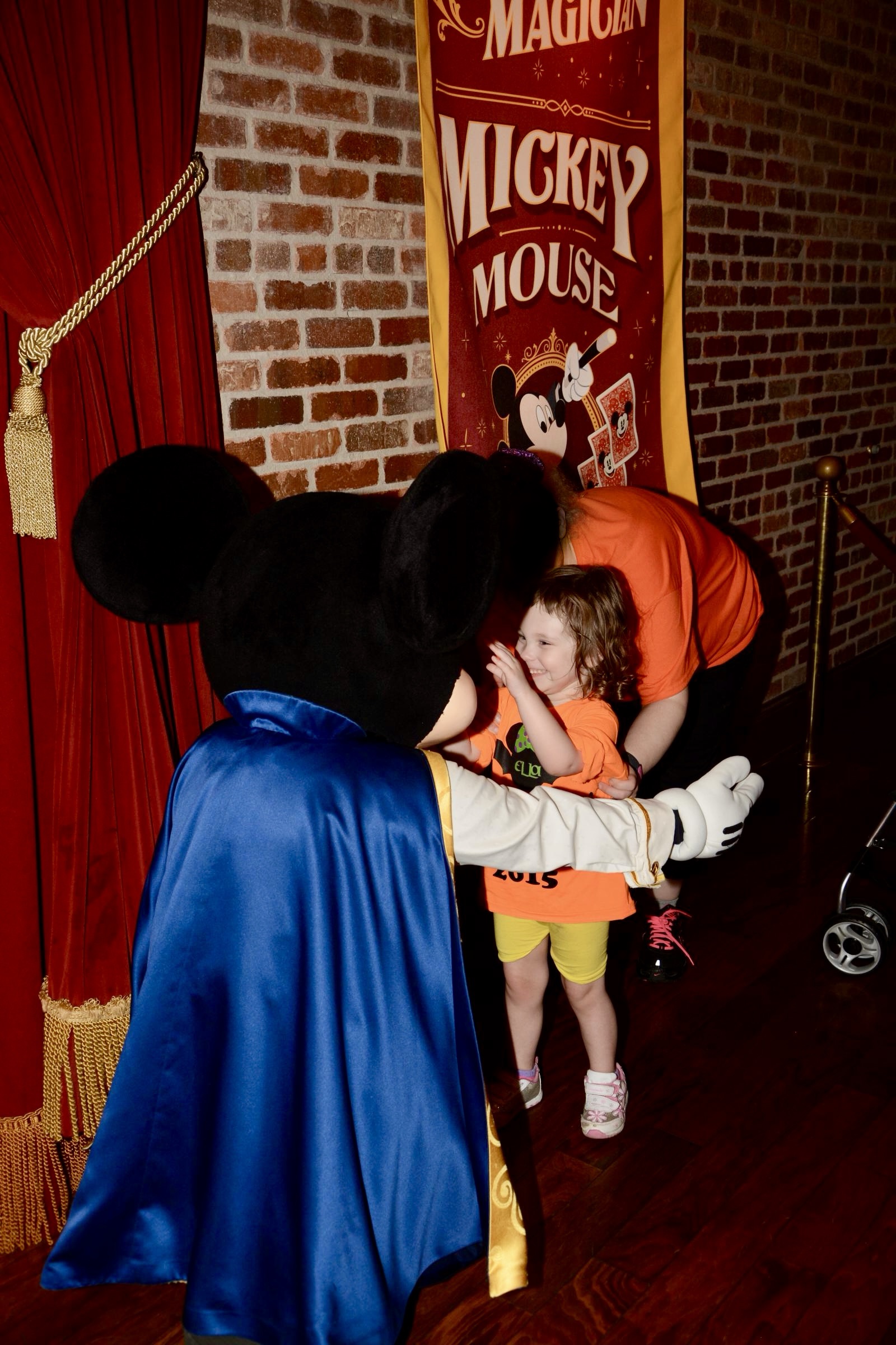 A young girl meeting Mickey Mouse at Magic Kingdom on Halloween 2016.